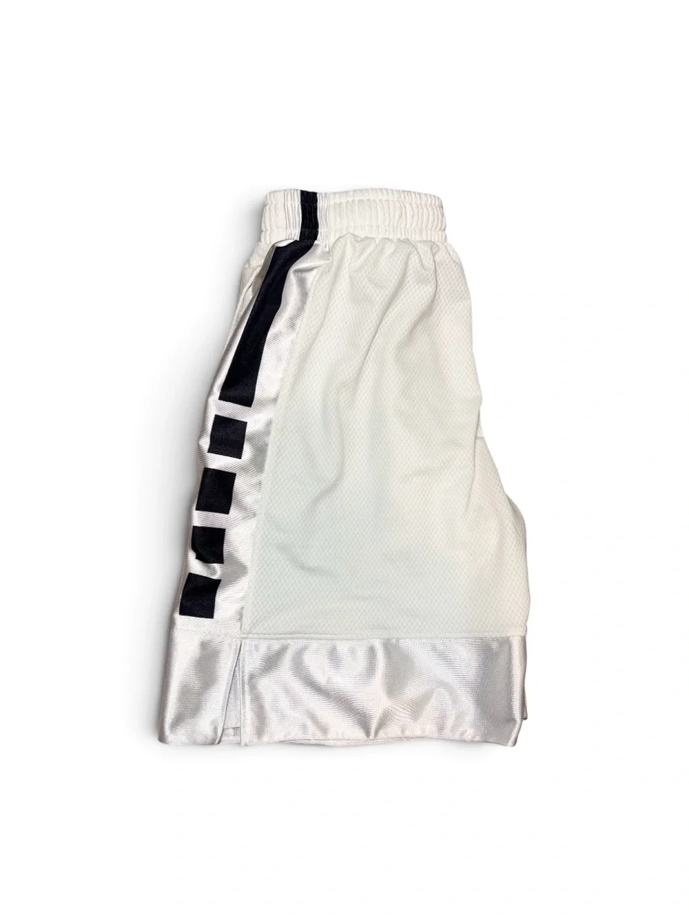 Nike Dri-Fit white basketball shorts with black stripes on sides, Youth size M